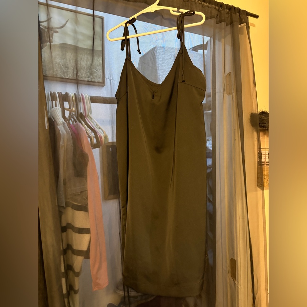 Women’s mini black dress. Has tie-able straps